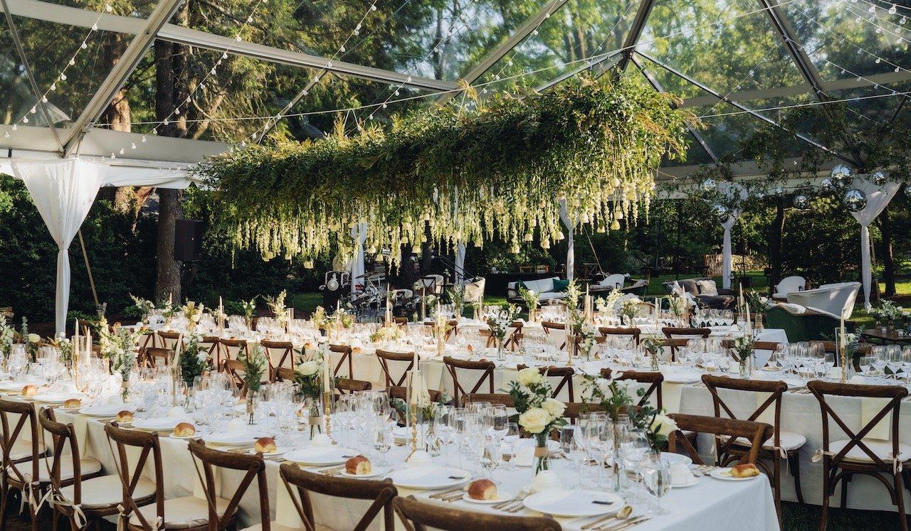Outdoor tented reception with clear roof